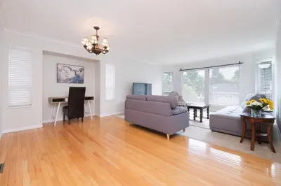 a living room with a couch and a table at Surrey Family Home w/ Patio & Garden – 3BR 2BA in Surrey