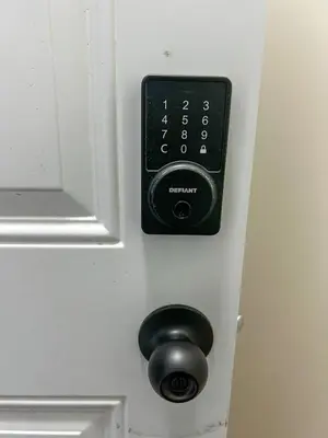 a door with a lock and a knob on it at Eli's Place in Calgary