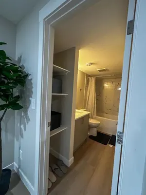 a bathroom with a toilet and a sink at Eli's Place in Calgary