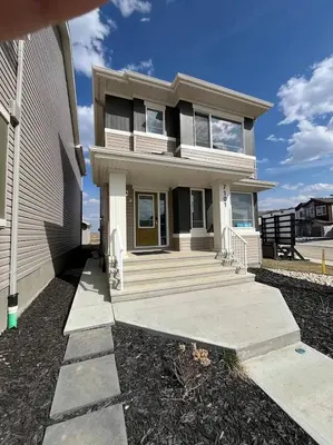 a house with a walkway in front of it at stylish 5-Star Suite 1BD 1 Bath Le Reve Beaumont in Nisku