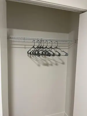 a group of shoes on a rack in a closet at Full Luxury home 4 BD ,AC,sleep 14,BBQ, 2V Garage in Edmonton