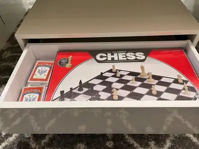 a chess game in a box on a table at Full Luxury home 4 BD ,AC,sleep 14,BBQ, 2V Garage in Edmonton
