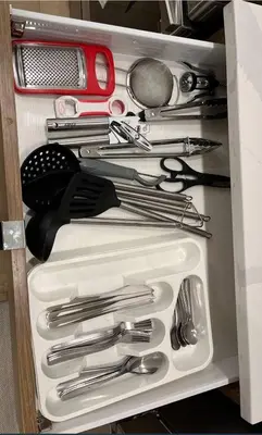a drawer filled with silver utensils in a drawer at Full Luxury home 4 BD ,AC,sleep 14,BBQ, 2V Garage in Edmonton