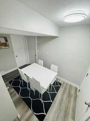 a meeting room with a white table and chairs at True Haven in Prince George