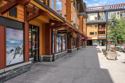 an empty street in a town with buildings at Ha Ling Haven - Penthouse with Shared Rooftop Hot Tub in Canmore