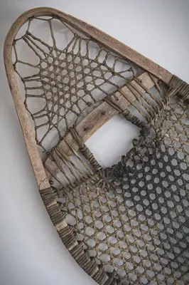 a woven basket with a glass top on a wall at Mountainside - Stunning Views Downtown Location in Canmore