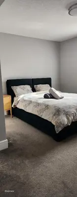 a bedroom with two beds in a room at The Vaulted Oasis 2-bedroom with a Garden in Airdrie