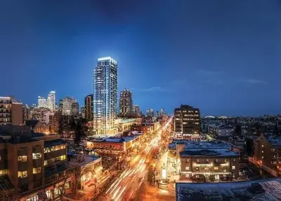 a view of a city at night with buildings at Stay Heart of Calgary, Enjoy Night Life, Free Parking Incl in Calgary