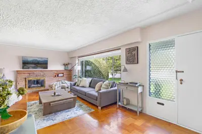 a living room with a couch and a fireplace at Spacious Home with Indoor Pool in Vancouver