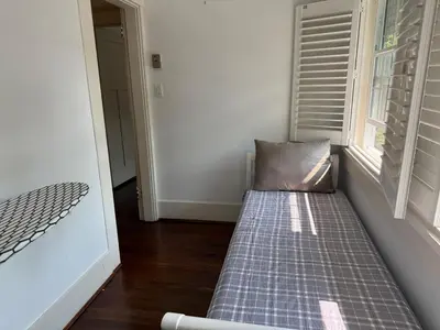 a couch in a room with a window at Spacious Villa 6BR 3 BA - Free Parking - Near Kitsilano Beach & Attractions - 15' to DT in Vancouver