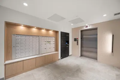 a dressing room with a walk in closet and a door at Chic Condo with Stylish Amenities in White Rock in Surrey