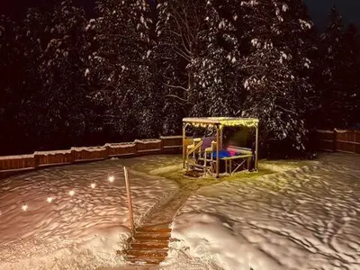 a gazebo in the snow at night at The White House in Golden