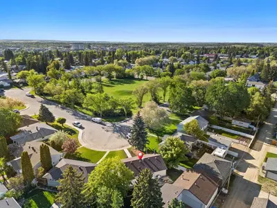 an aerial view of a suburb with houses at Nineteen55 4BR Parkside Home in Central Red Deer in Red Deer