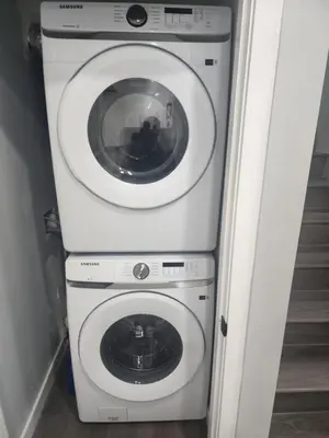 a washer and dryer in a small room at Home in Northwest Calgary in Calgary