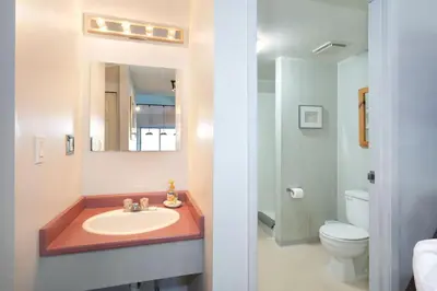 a bathroom with a sink and a toilet at Whistler Corner Loft Next to lift with Amazing views! in Whistler