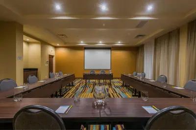 a large conference room with a projector screen in it at Fairfield Inn & Suites by Marriott Kamloops in Kamloops
