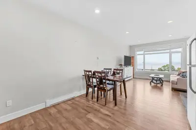 a dining room and living room with a table and chairs at Nanaimo 2BR Oceanview Suite w/ Kitchen & Laundry in Nanaimo