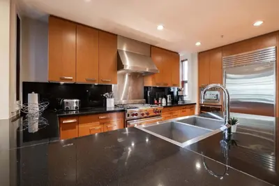 a kitchen with a sink and a stove at Fitzsimmons Walk 21 by Outpost Whistler in Whistler