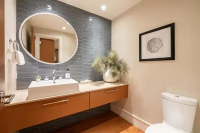 a bathroom with a sink and a mirror at Fitzsimmons Walk 21 by Outpost Whistler in Whistler