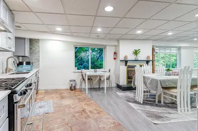 a kitchen and dining room with a table and chairs at Spacious 3Bedrooms Family Getaway in North Vancouver in North Vancouver