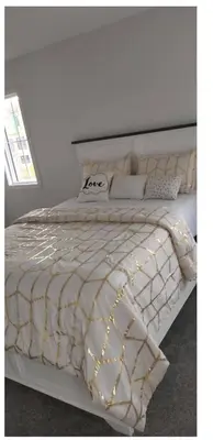 a white bed with lights on it in a bedroom at Bedroom in Southwest 2 in Edmonton