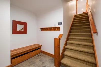 a staircase in a room with a stair case at Foxglove 16 by Outpost Whistler in Whistler