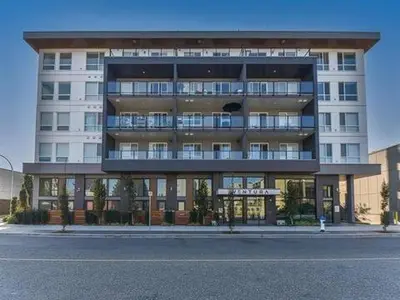 a large building on the side of a street at Ventura in Downtown in Abbotsford