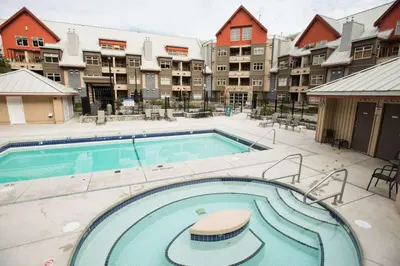 a swimming pool in front of a apartment complex at Lake Placid Lodge 18 by Outpost Whistler in Whistler