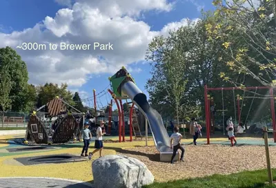 a group of people playing on a playground at Private Entire Guest Suite, 1 min to bus stops to Downtown and major attractions in Vancouver