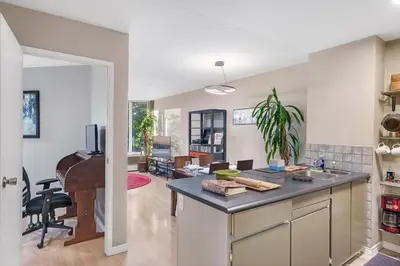 an open kitchen and living room with a piano at Cozy Home in Downtown Minutes from Seawall in Vancouver