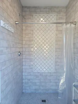 a shower with a glass window in a bathroom at Gibsons Creek RV Resort and Campground in Gibsons