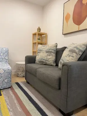 a living room with a couch and a chair at 1Bd Modern Suite close to Langley Events Centre and Hwy1 in Langley