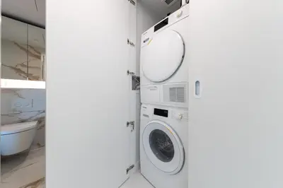 a laundry room with a washer and dryer at Brand New One-bedroom Apartment in Vancouver