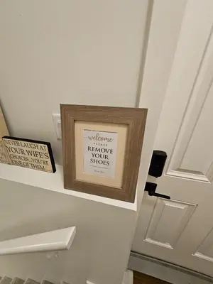 a picture in a frame next to a door at Emeka & Comfort in Calgary
