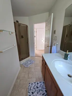 a bathroom with a sink and a shower and a tub at Luxury 3BR Home, 2 King Beds, Near cafes and groceries in North Vancouver