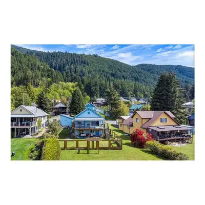 an aerial view of a small town with houses at Youbou Lakefront Getaway Relax And Unwind in Youbou