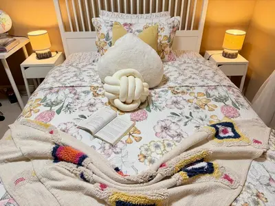 a bed with a stuffed animal and a book on it at Scorpio House Langley in Langley
