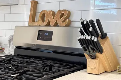 a knife block next to a stove in a kitchen at #RusticModern3CornerSuite|KingBED|Parking|WEM|wifi in Edmonton