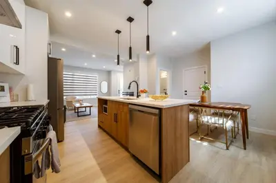 a kitchen with a large island and a stove at #RusticModern3CornerSuite|KingBED|Parking|WEM|wifi in Edmonton