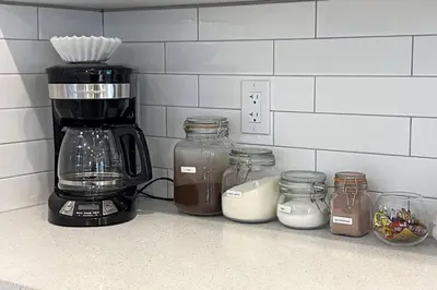 a kitchen counter with jars and a coffee maker at #RusticModern3CornerSuite|KingBED|Parking|WEM|wifi in Edmonton