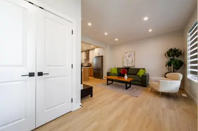 a living room with a couch and a table at #RusticModern3CornerSuite|KingBED|Parking|WEM|wifi in Edmonton