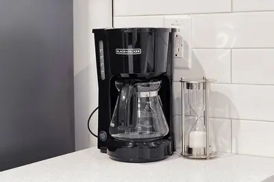 a black blender sitting on a kitchen counter at RoyalBlueBSMTsuite/KingBed/FreeParking/Netflix in Edmonton