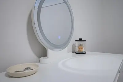 a white bathroom with a mirror and a sink at 1 BR Suite Stylish Coffee Station Stocked sleep 4 in Edmonton