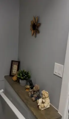 a shelf with stuffed animals and a clock on a wall at Blissful Nest - Cozy, Classy 2 Bedroom Private Suite Netflix, free Parking, 20 minutes to West Edmonton Mall and Airport in Edmonton