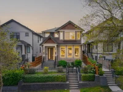 a large house with stairs in front of it at Upscale 4BR Vancouver in Vancouver