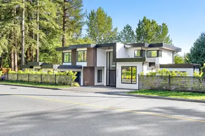 a house on the side of a road at 2505 Edgemont Blvd.- Anupoju in North Vancouver