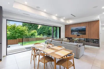 a living room with a table and a couch at 2505 Edgemont Blvd.- Anupoju in North Vancouver