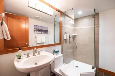 a bathroom with a sink and a shower at Ravencrest 309 by Outpost Whistler in Whistler
