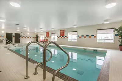 a large swimming pool in a building at Comfort Inn & Suites Edmonton International Airport in Nisku