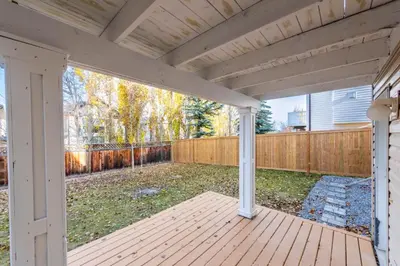 an empty porch of a house with a fence at Valley Home 2 Bed 1 Bath Walkout Basement Apartment, 1hr to Banff, 40 Mins Canmore, 5 mins to WinSport & Olympic park in Calgary